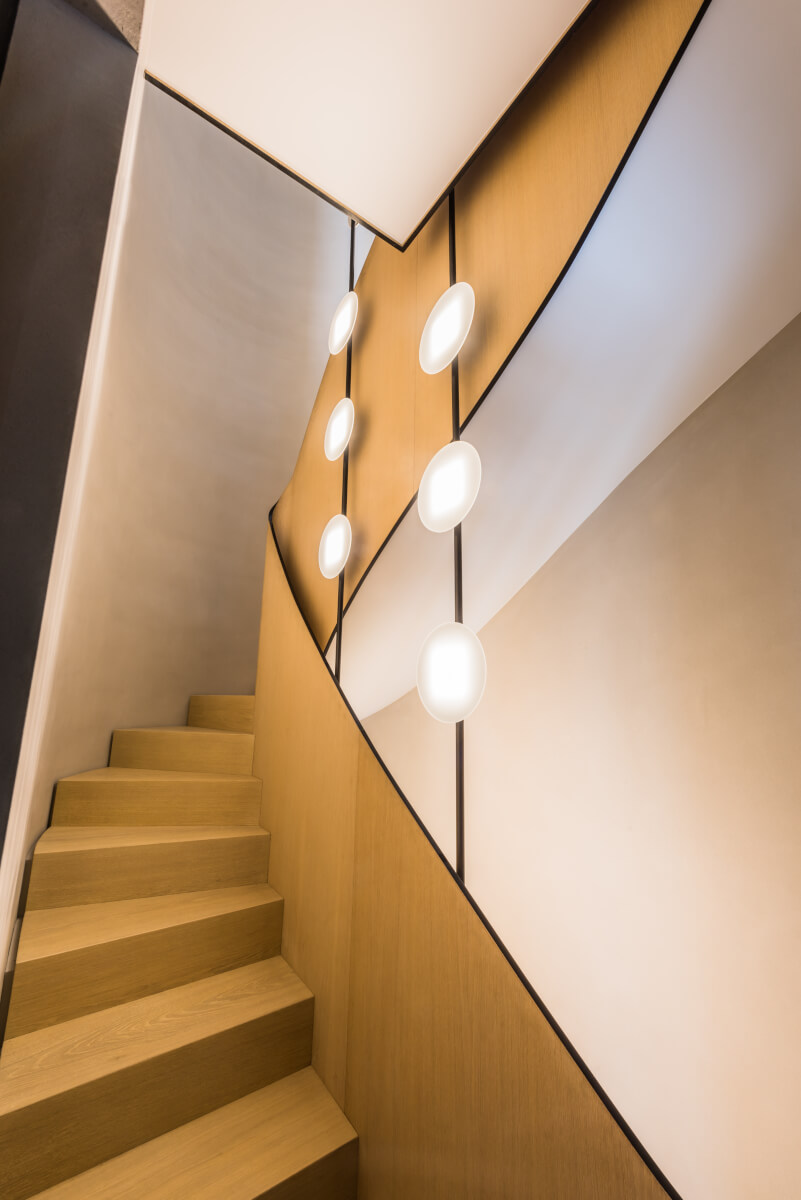 Two OLED light fixtures in the stairwell of a private residential building