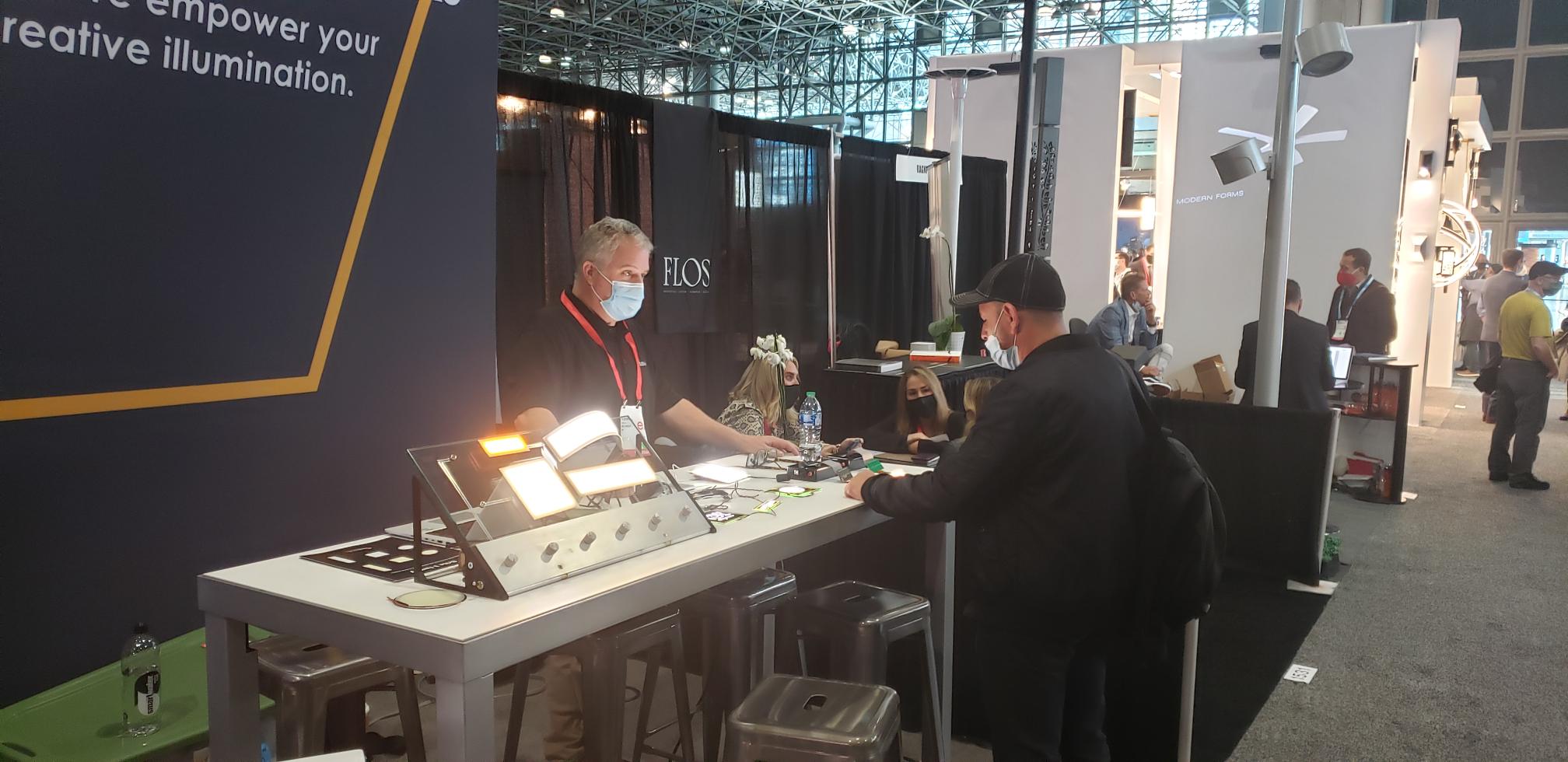 Attendee visits the OLEDWorks booth at LightFair