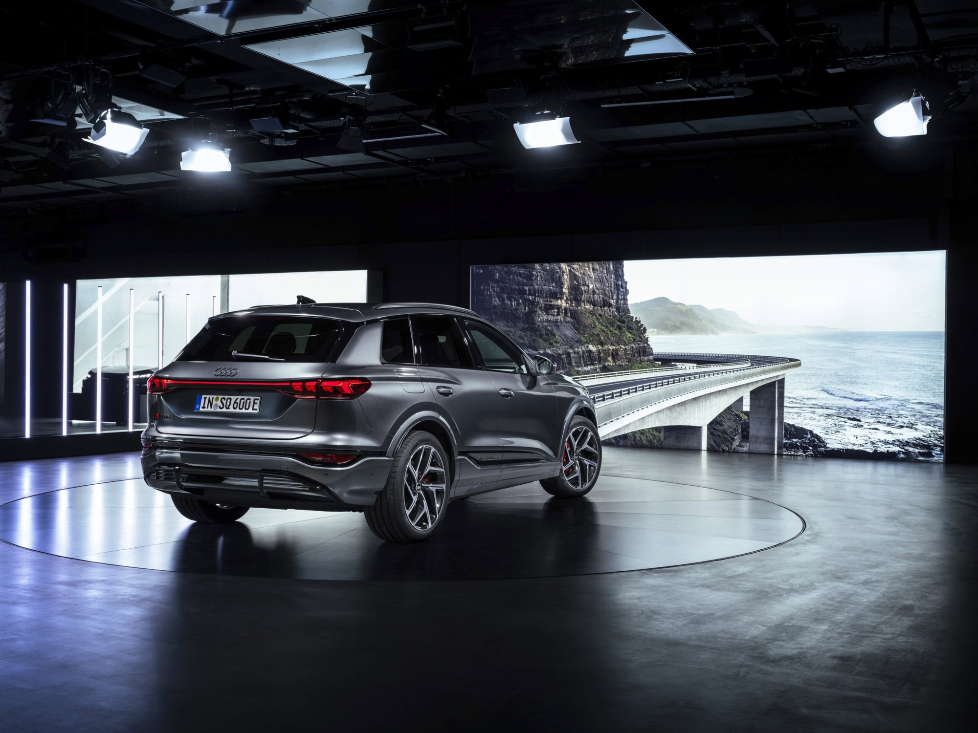 Grey car in showroom. Ocean view.